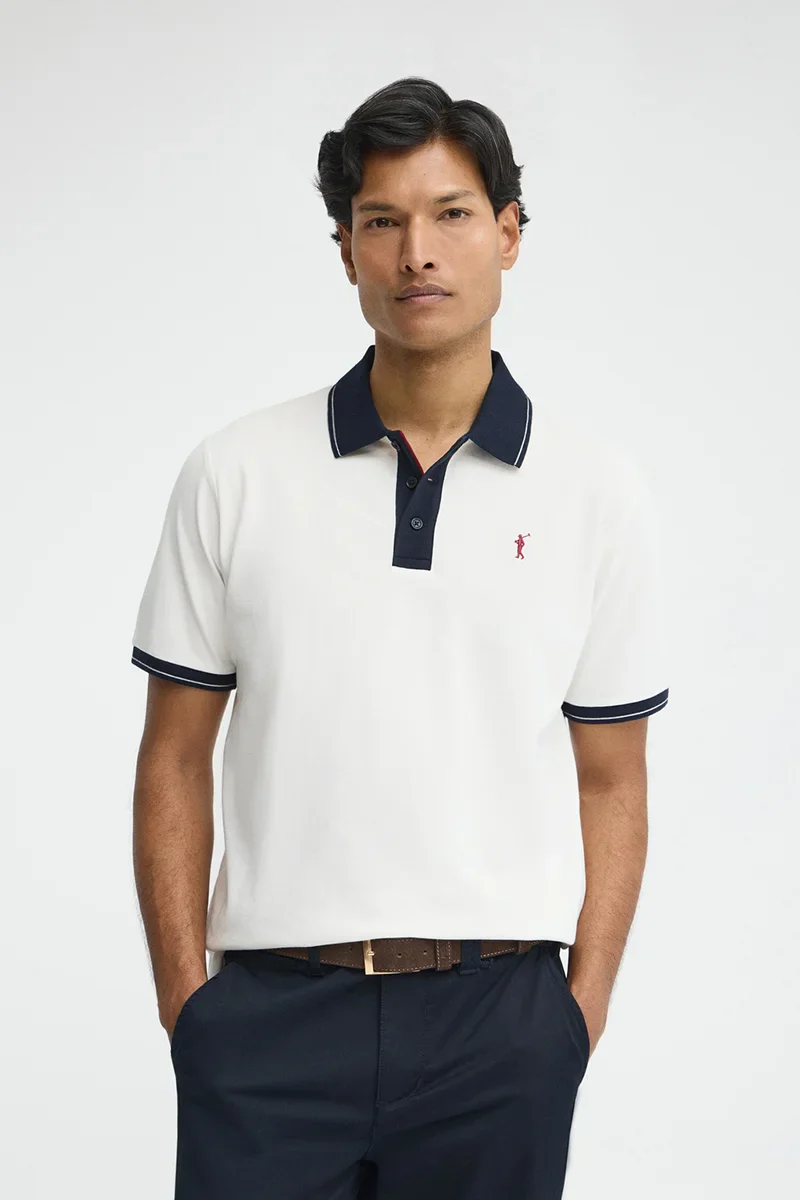 Nude polo shirt with contrast details and Rigby Go embroidery