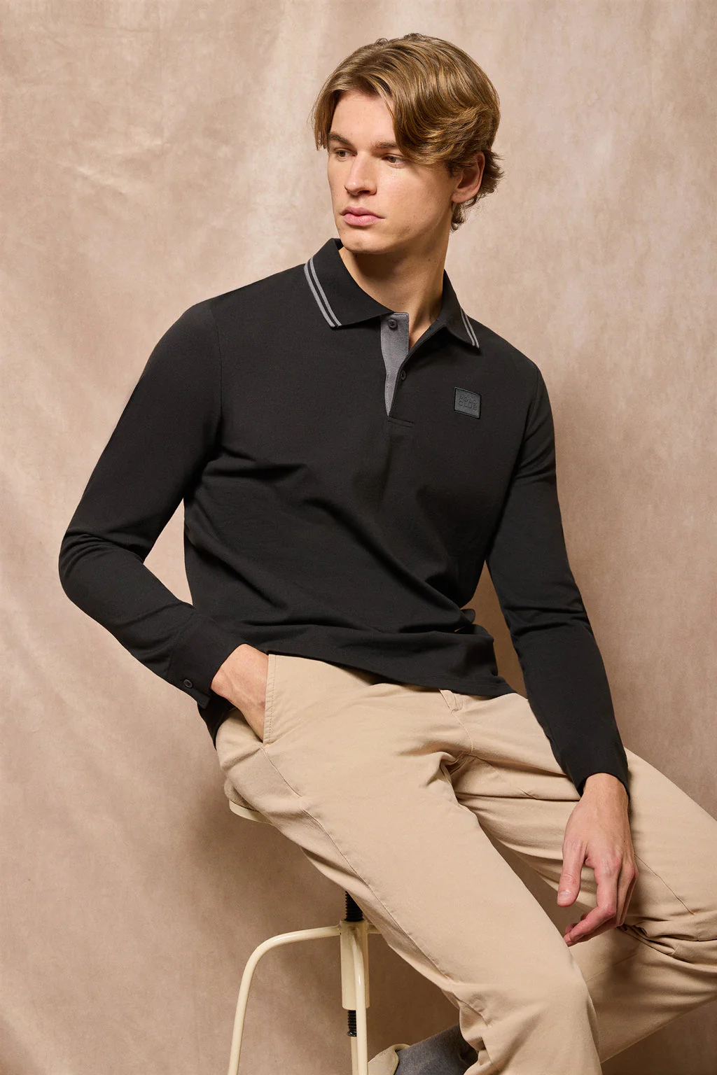 Black polo shirt with two buttons and Polo Club logo