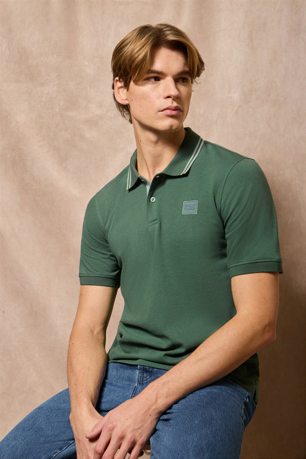 Green polo shirt with two buttons and Polo Club logo