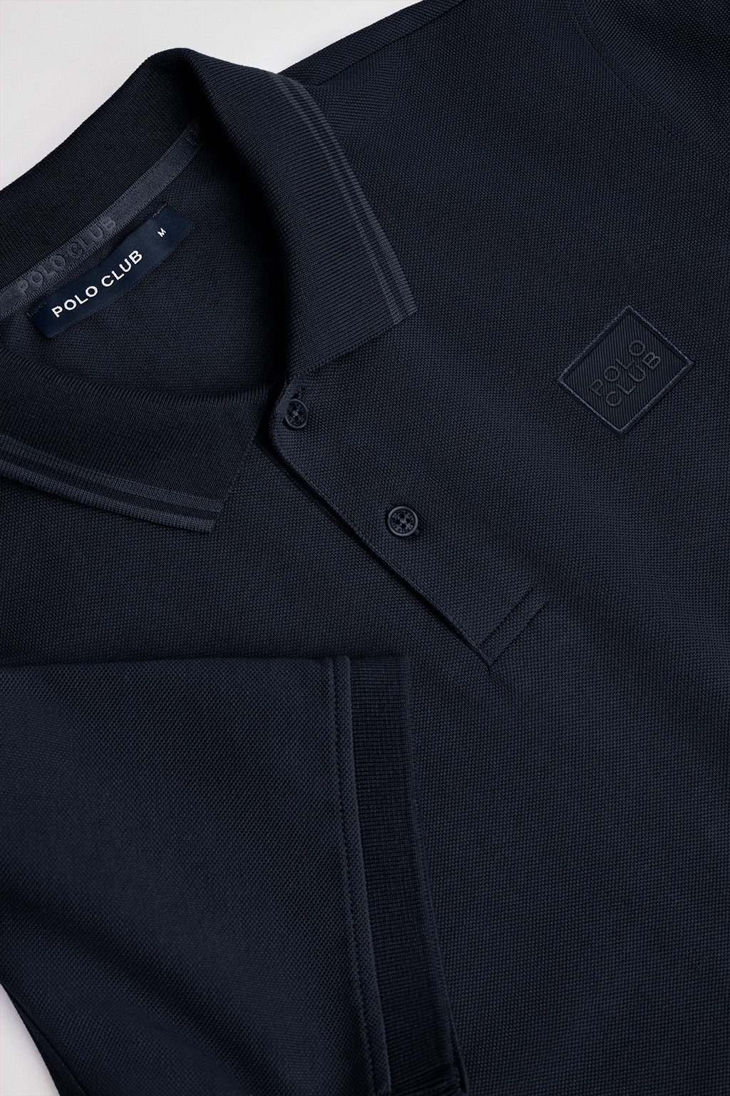 Navy-blue short-sleeve polo shirt with two buttons and chest detail - Image 6