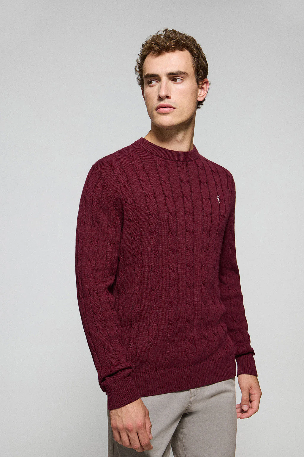 Maroon cable-knit jumper with Rigby Go logo