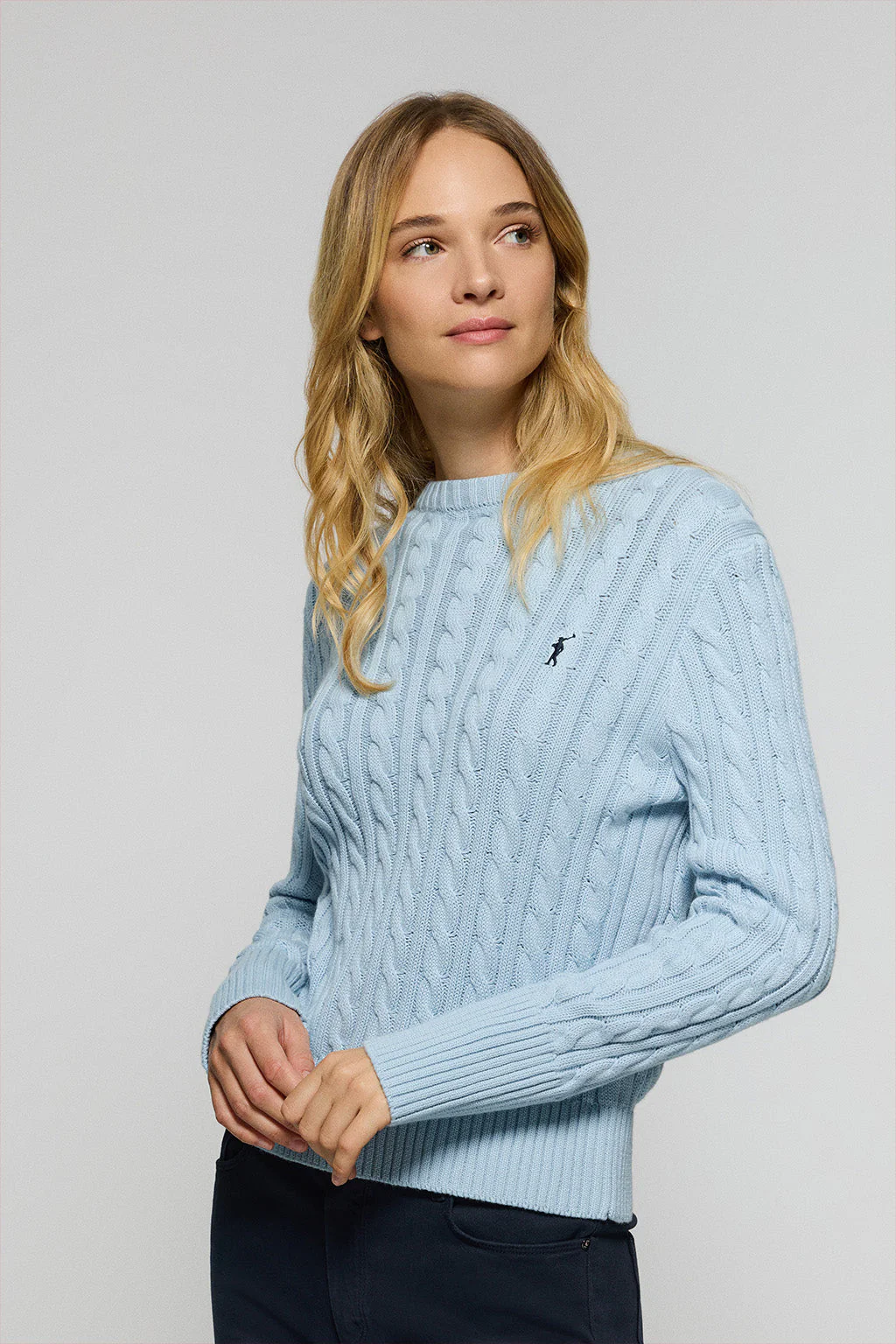 Light-blue cable-knit jumper with Rigby Go embroidered logo