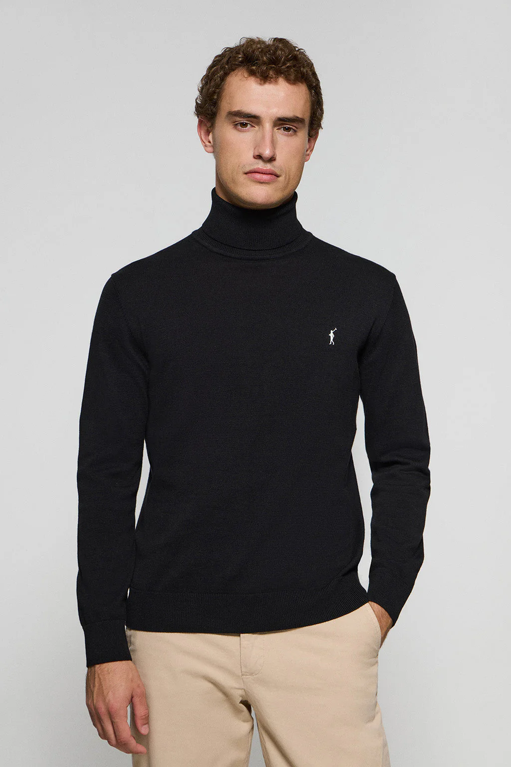 Black turtleneck knit jumper with Rigby Go embroidered logo
