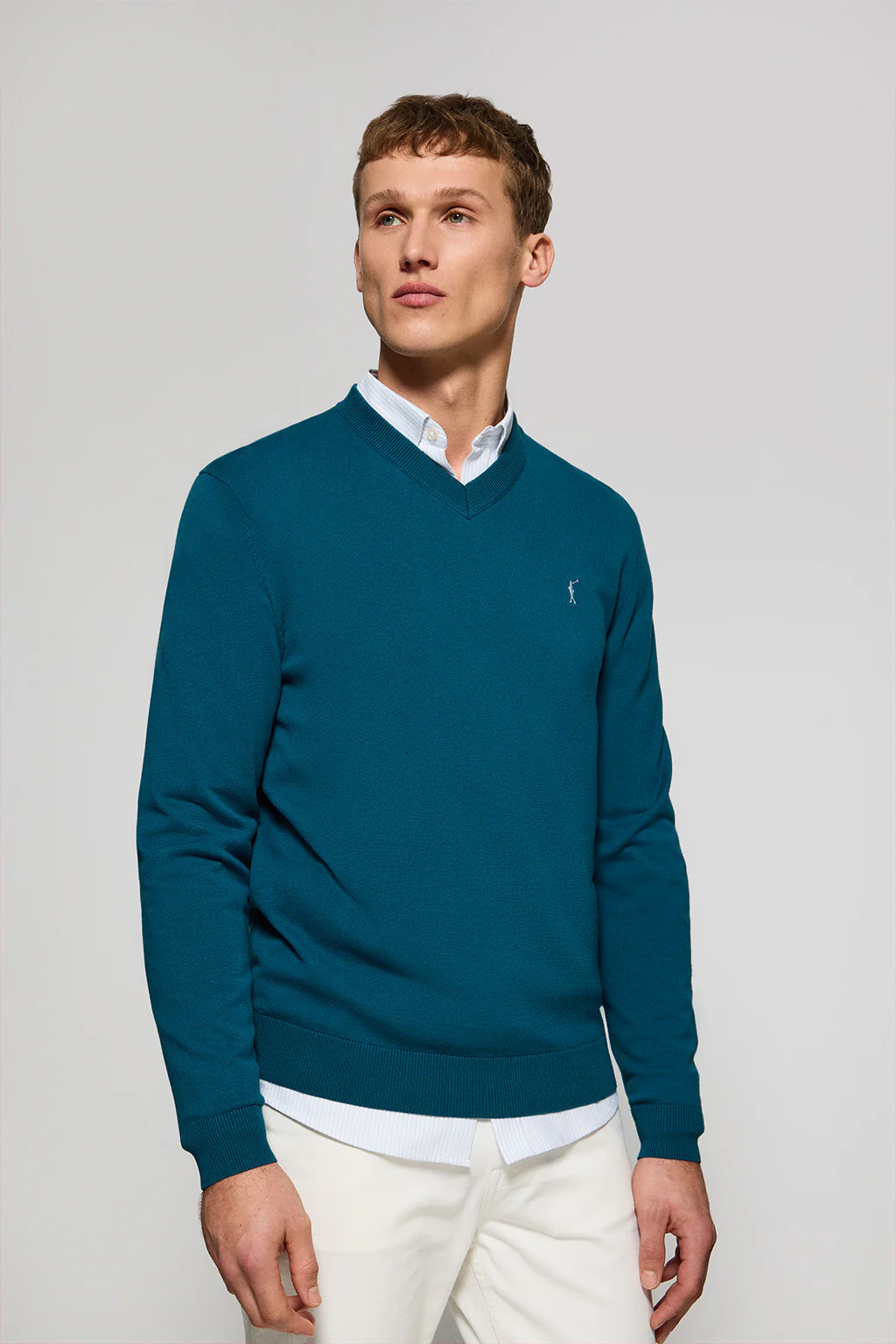 Greenish-blue V-neck knit jumper with Rigby Go embroidery