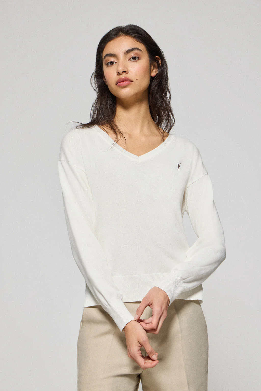 Nude V-neck knit jumper with Rigby Go embroidered logo