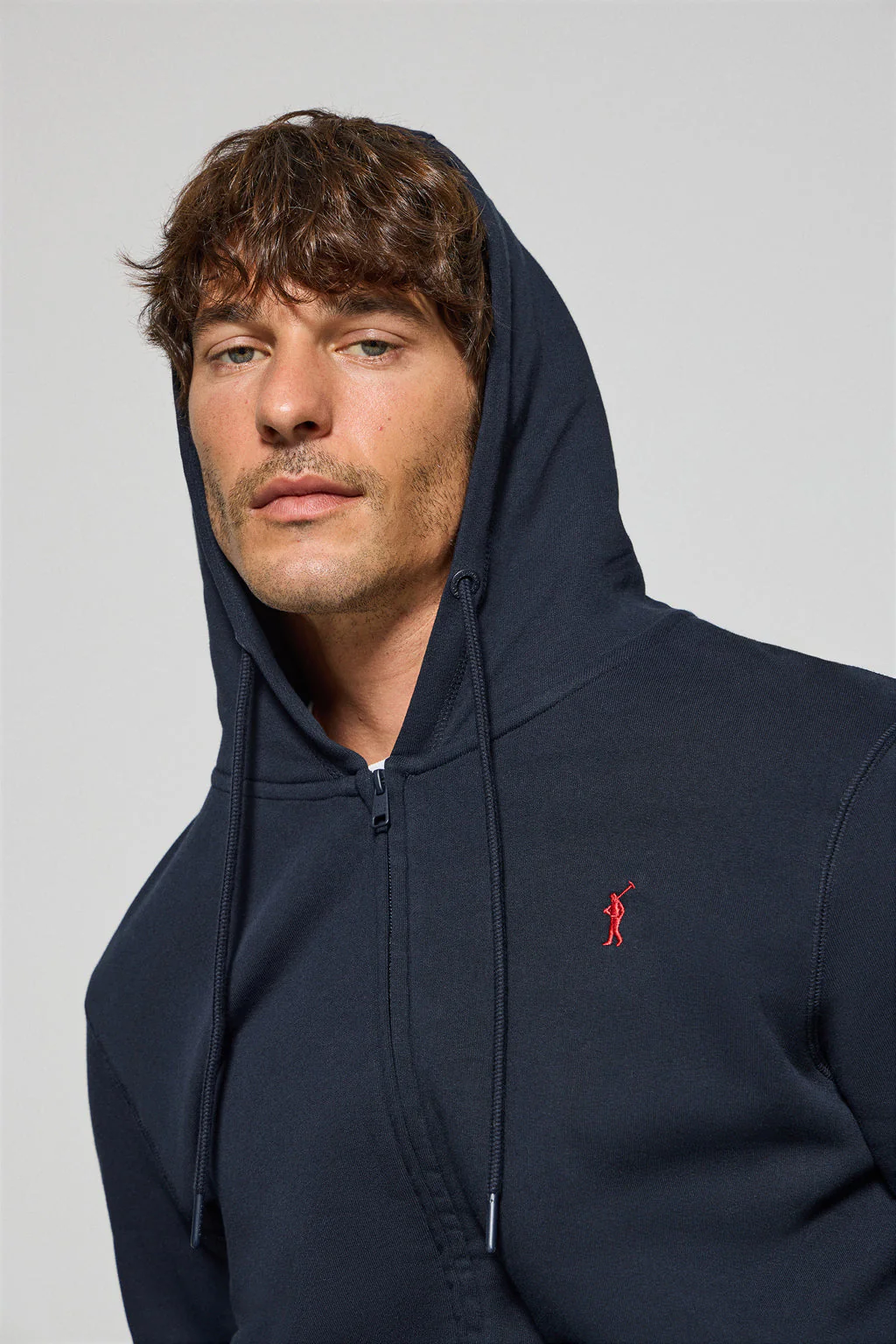 Navy-blue zip-up hoodie with Rigby Go logo - Image 4