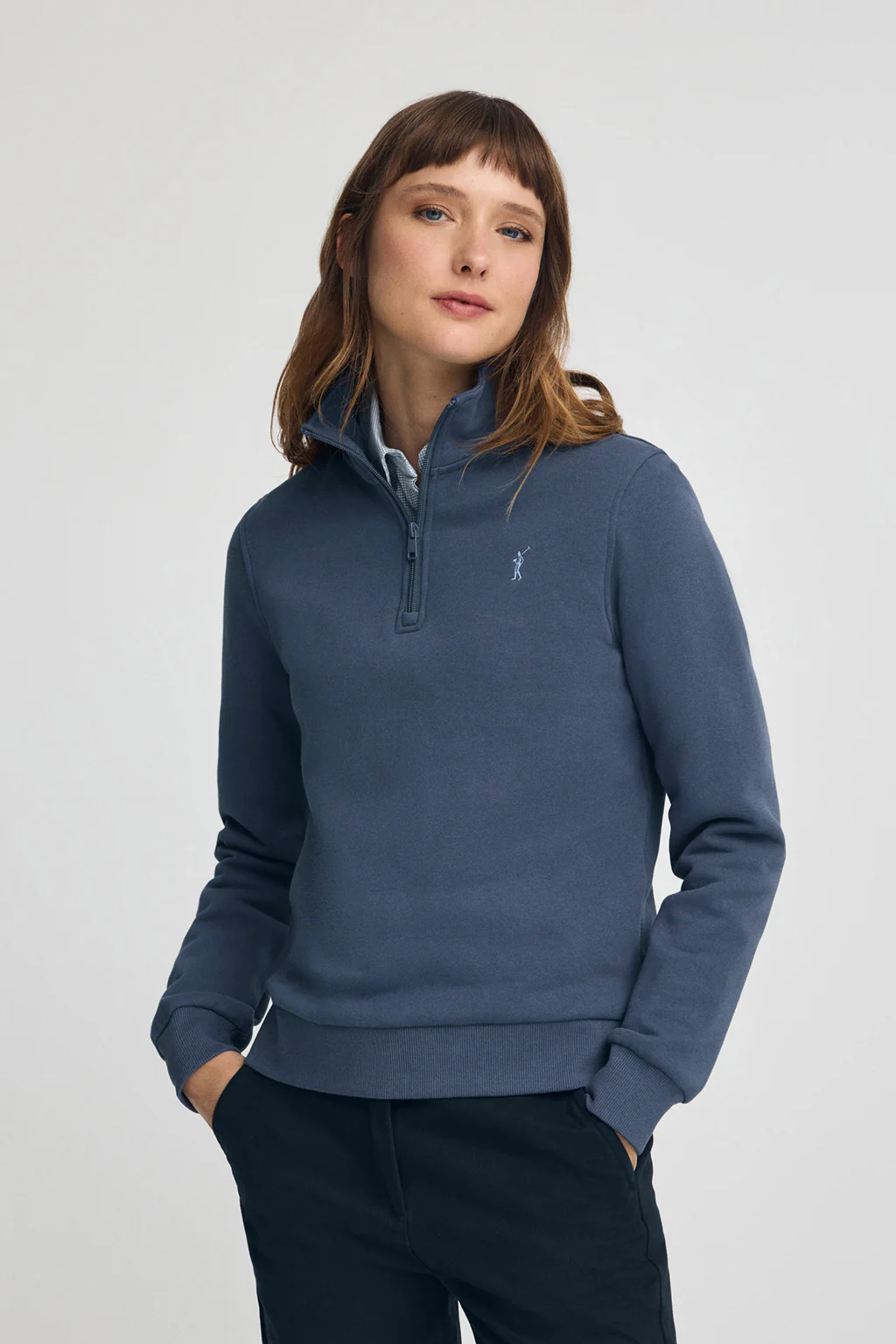 Denim-blue half-zip sweatshirt with Rigby Go logo