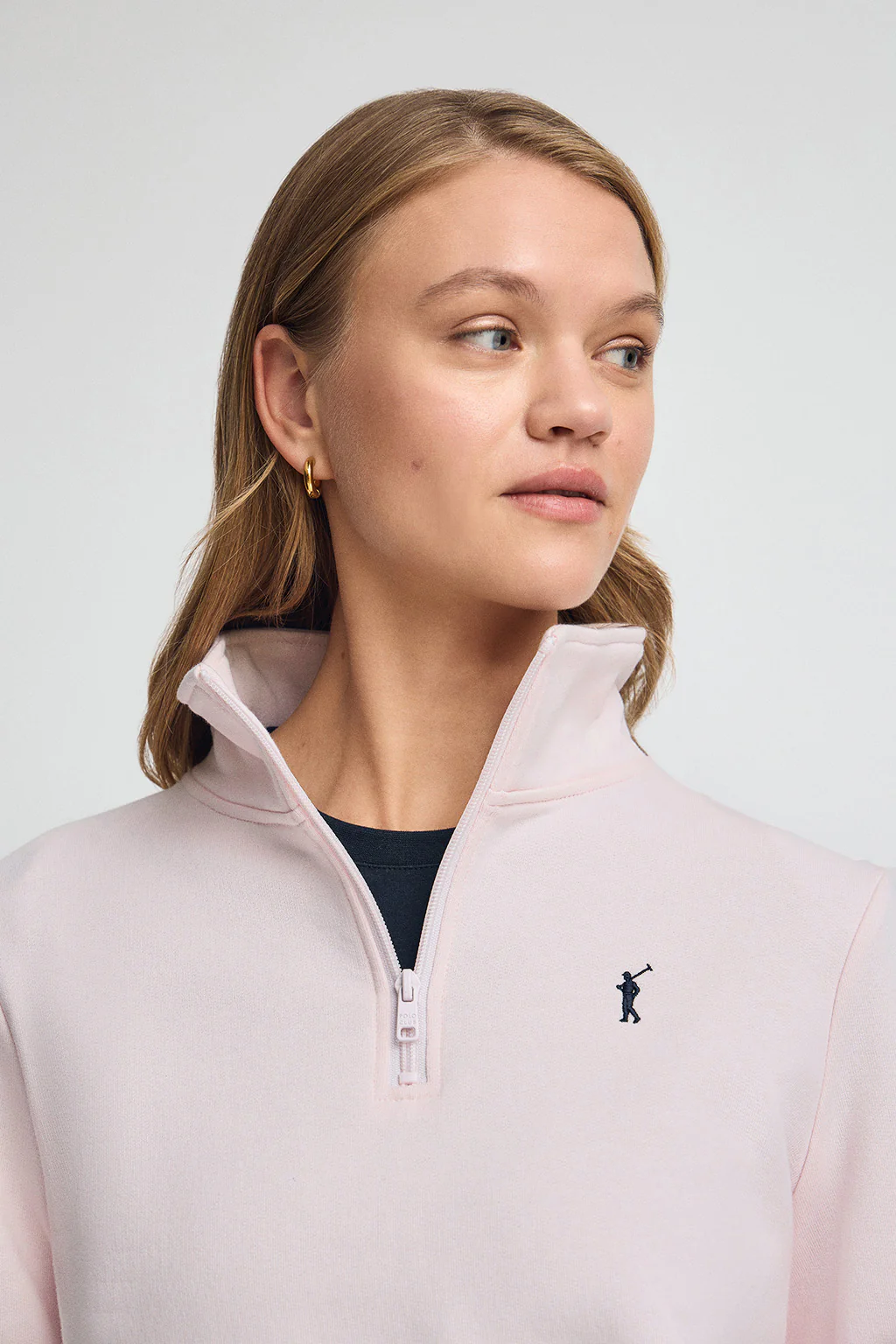 Pink half-zip sweatshirt with Rigby Go embroidery