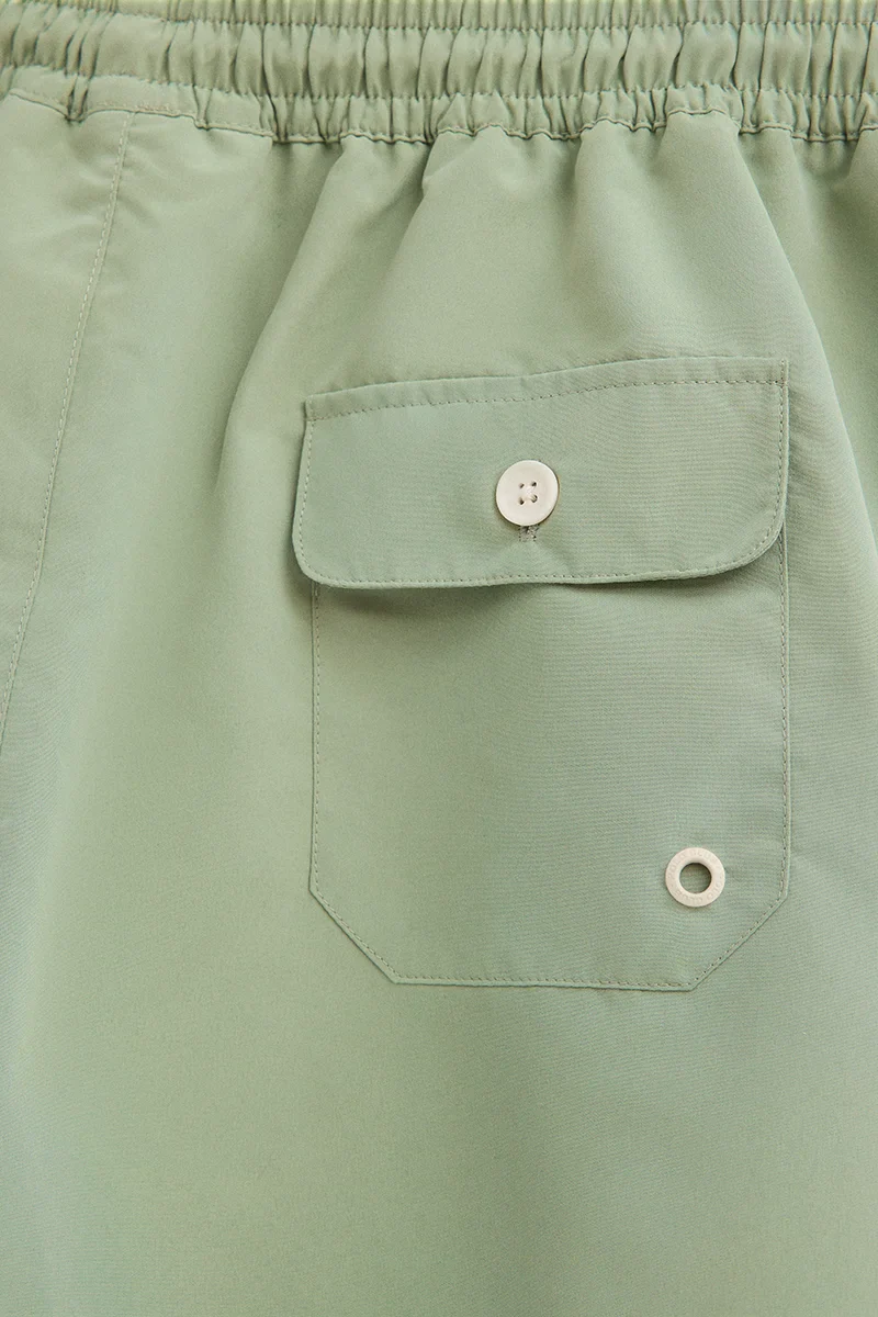 Pale-green short swim shorts with Rigby Go logo - Image 4