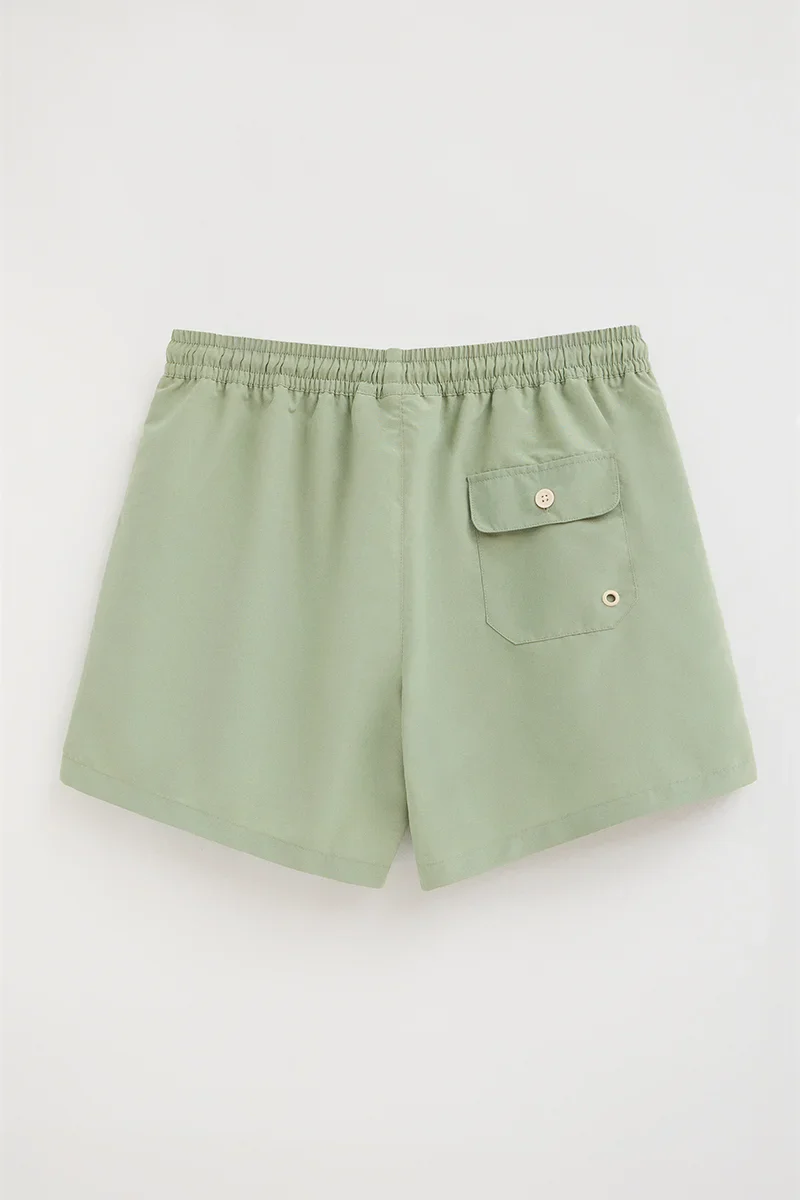 Pale-green short swim shorts with Rigby Go logo - Image 5