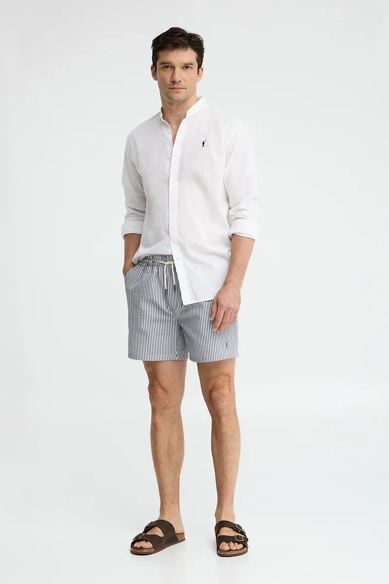 Short swim shorts in grey and white with crinkled texture and Rigby Go logo