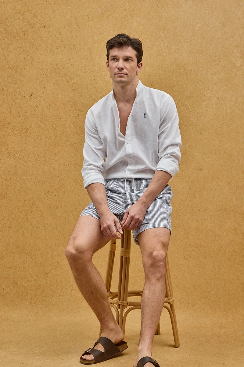 Short swim shorts in grey and white with crinkled texture and Rigby Go logo - Image 3