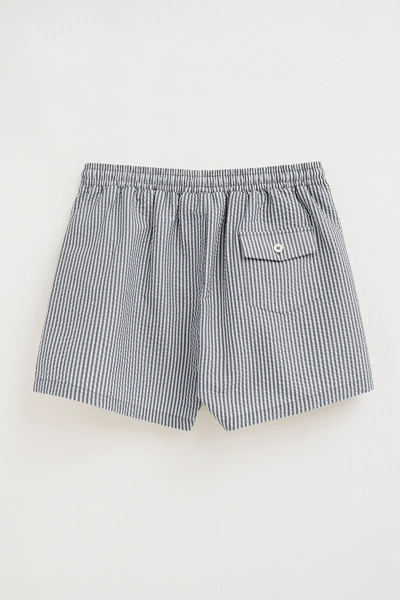 Short swim shorts in grey and white with crinkled texture and Rigby Go logo - Image 9