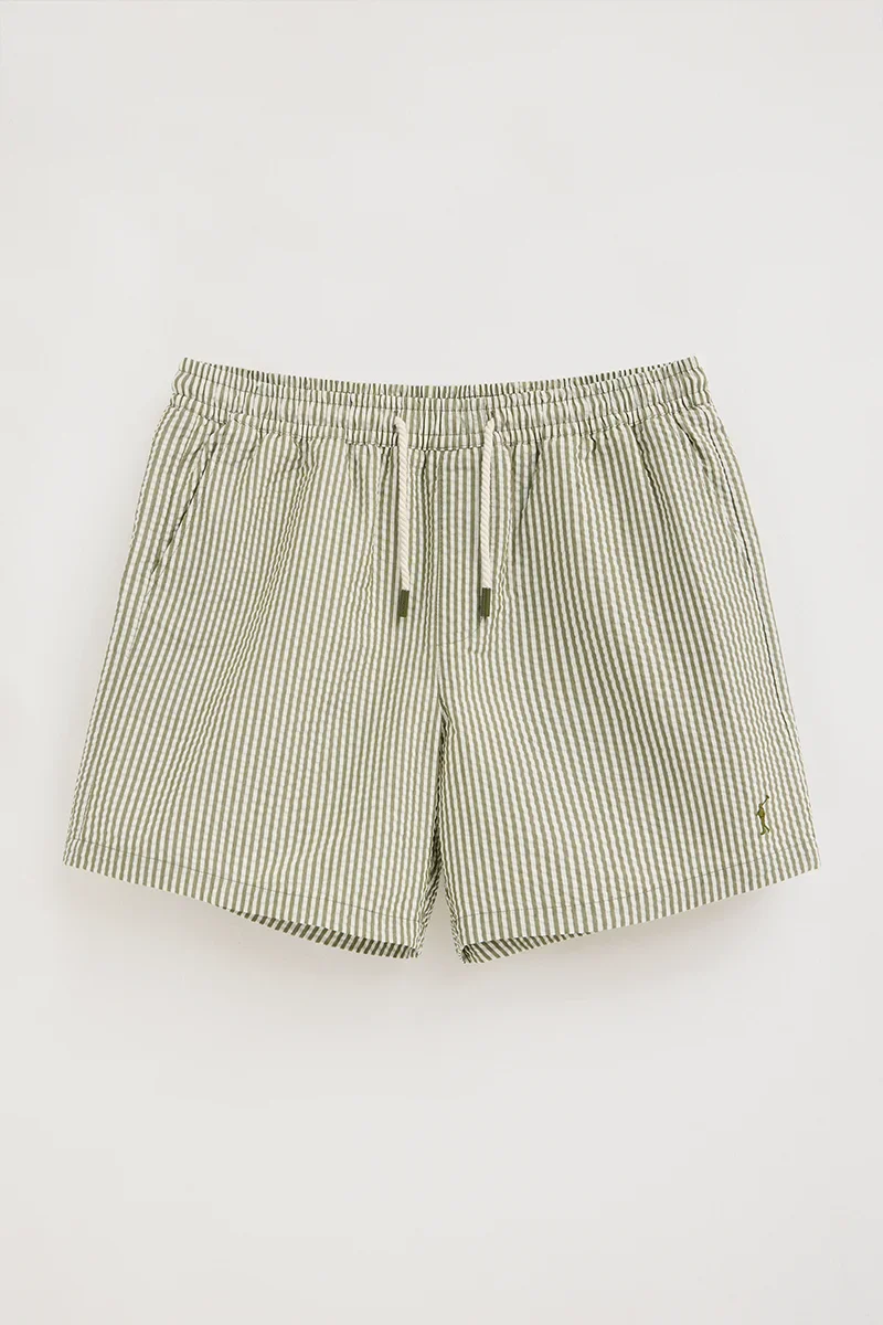 Short swim shorts in moss green and nude with crinkled texture and Rigby Go logo - Image 10