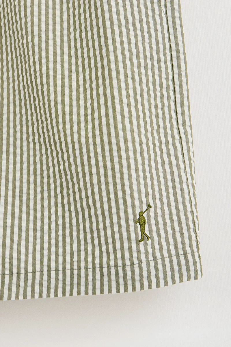 Short swim shorts in moss green and nude with crinkled texture and Rigby Go logo - Image 7