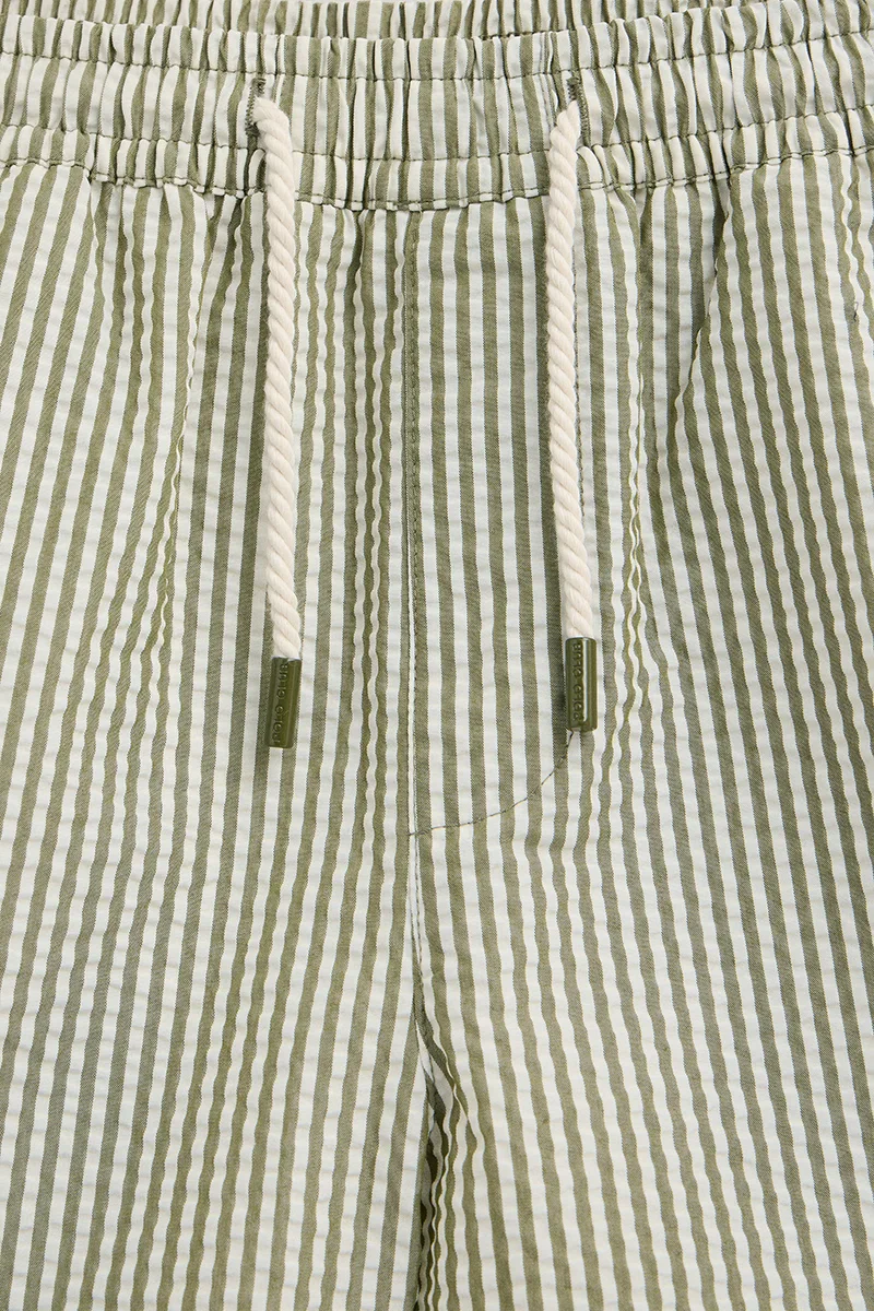 Short swim shorts in moss green and nude with crinkled texture and Rigby Go logo - Image 8