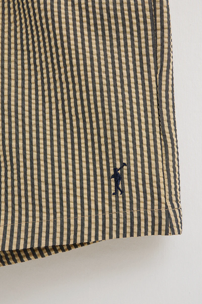 Short swim shorts in navy blue and beige with crinkled texture and Rigby Go logo - Image 2