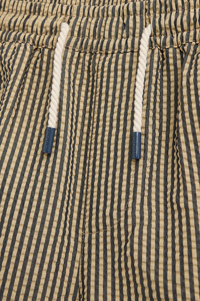 Short swim shorts in navy blue and beige with crinkled texture and Rigby Go logo - Image 3