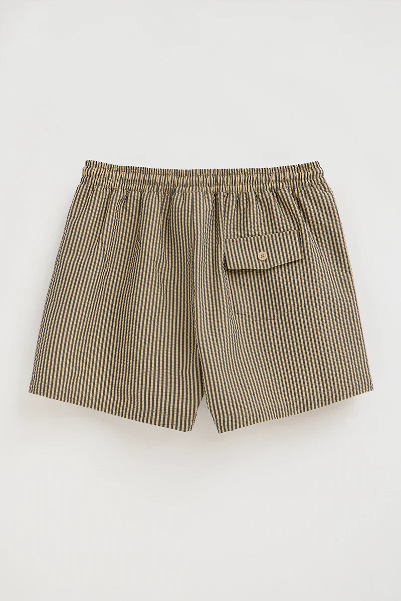 Short swim shorts in navy blue and beige with crinkled texture and Rigby Go logo - Image 5