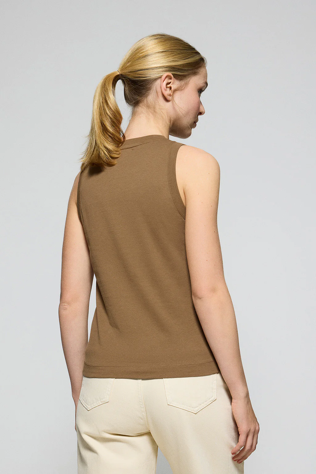 Brown sleeveless basic tee with round neck and Rigby Go embroidered logo - Image 2