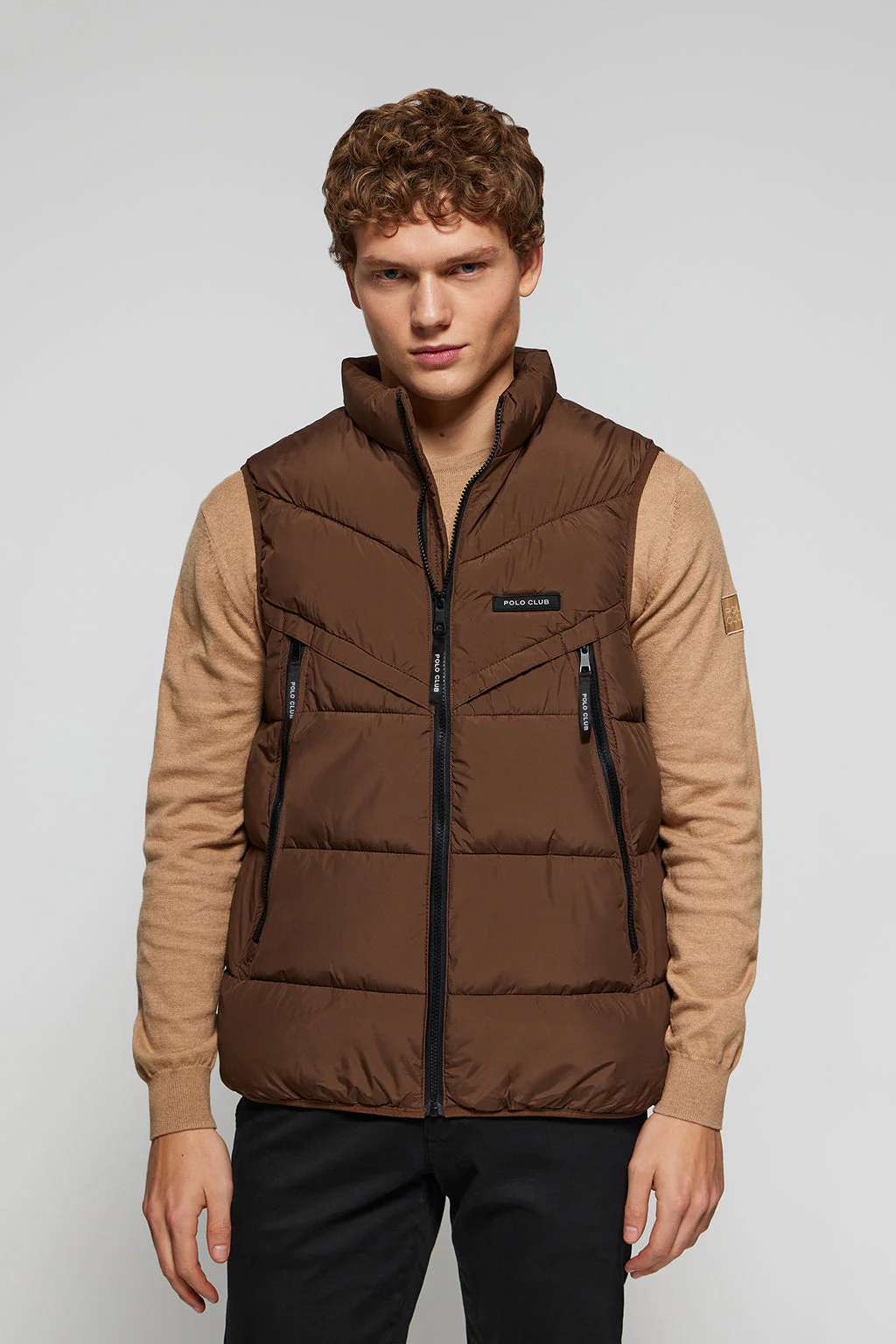 Brown puffer vest with branded details
