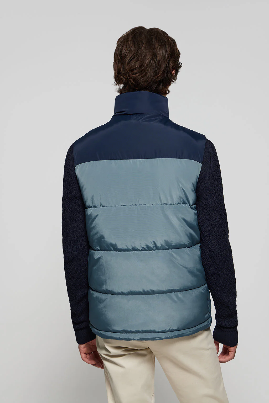 Denim-blue puffer vest with high collar and logo patch - Image 5