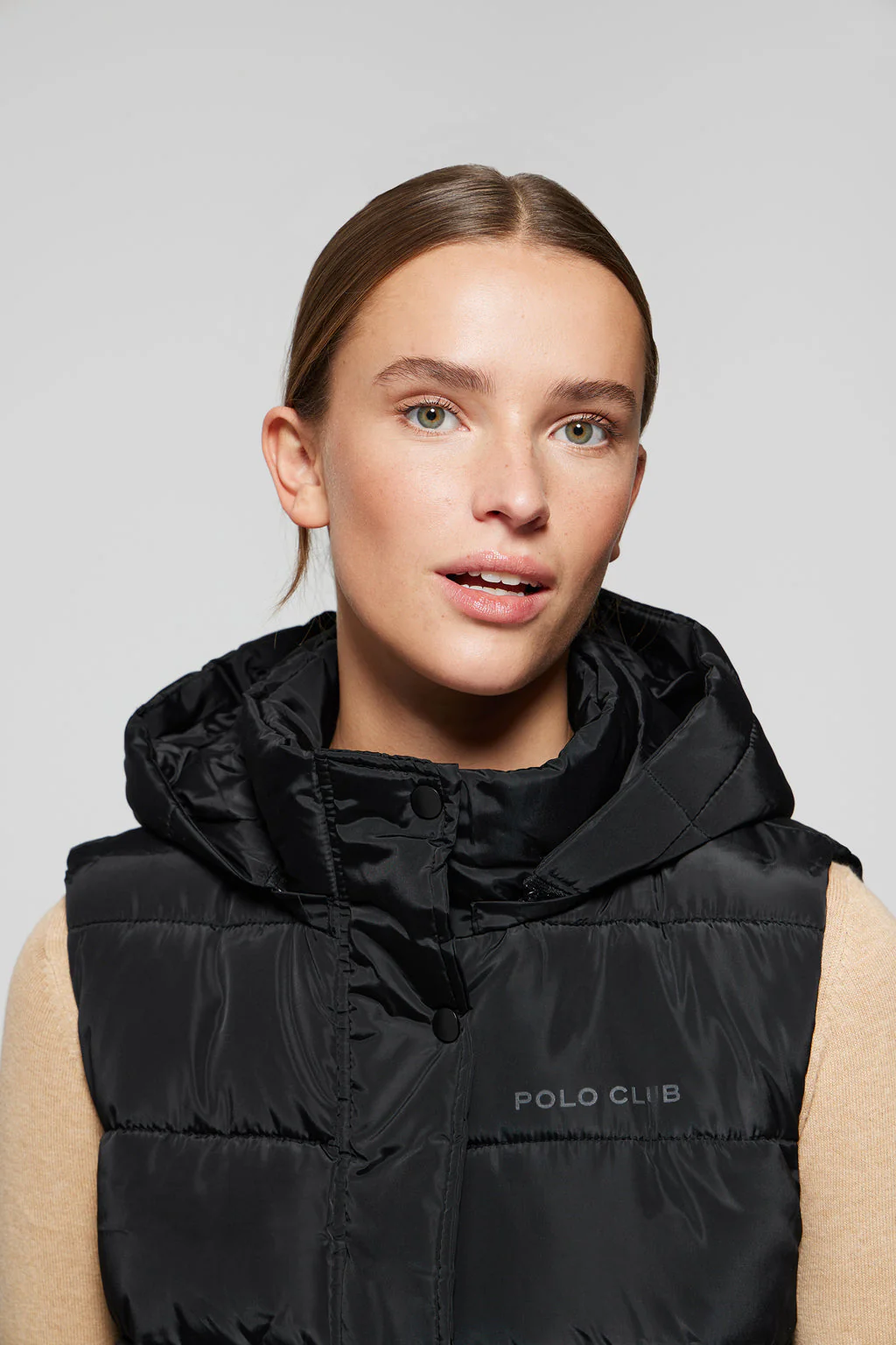Black puffer vest with hood and Polo Club print